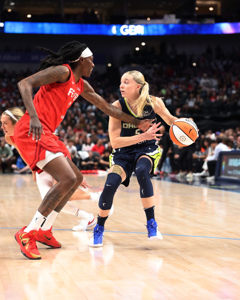 a group of women playing basketball Dallas Wings Vs Indiana Fever