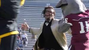 Cam Newton smacking a mascot.