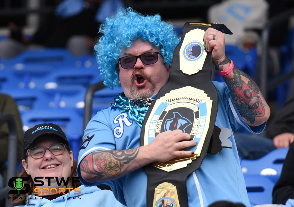 Dallas Renegades Fan with blue wig and championship belt