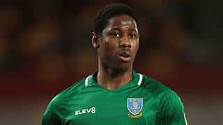 Osaze Urhoghide Goalkeeper in green uniform, focused expression