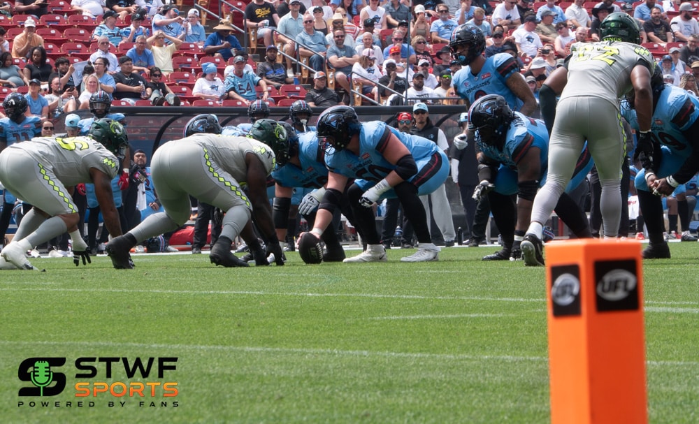 Dallas Renegades vs Louisville Kings UFL Football players preparing for snap