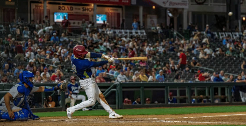 MiLB Frisco Roughrider Baseball player swinging at pitch
