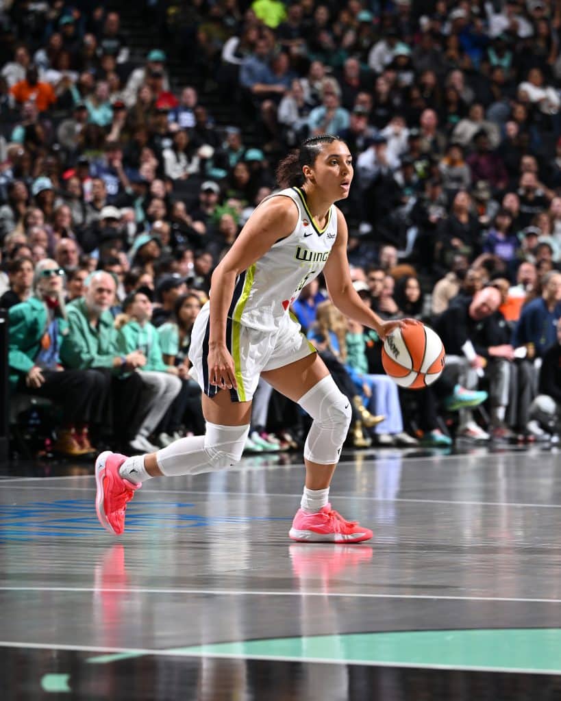 Azzi Fudd WNBA Basketball player dribbling on court