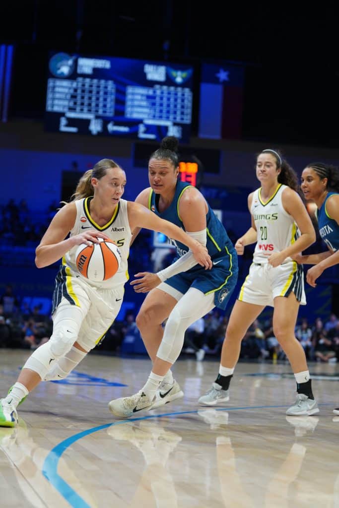 Paige Bueckers Basketball players competing on court