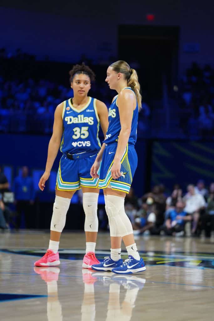 Azzi Fudd and Paige Bueckers Two basketball players discussing strategy