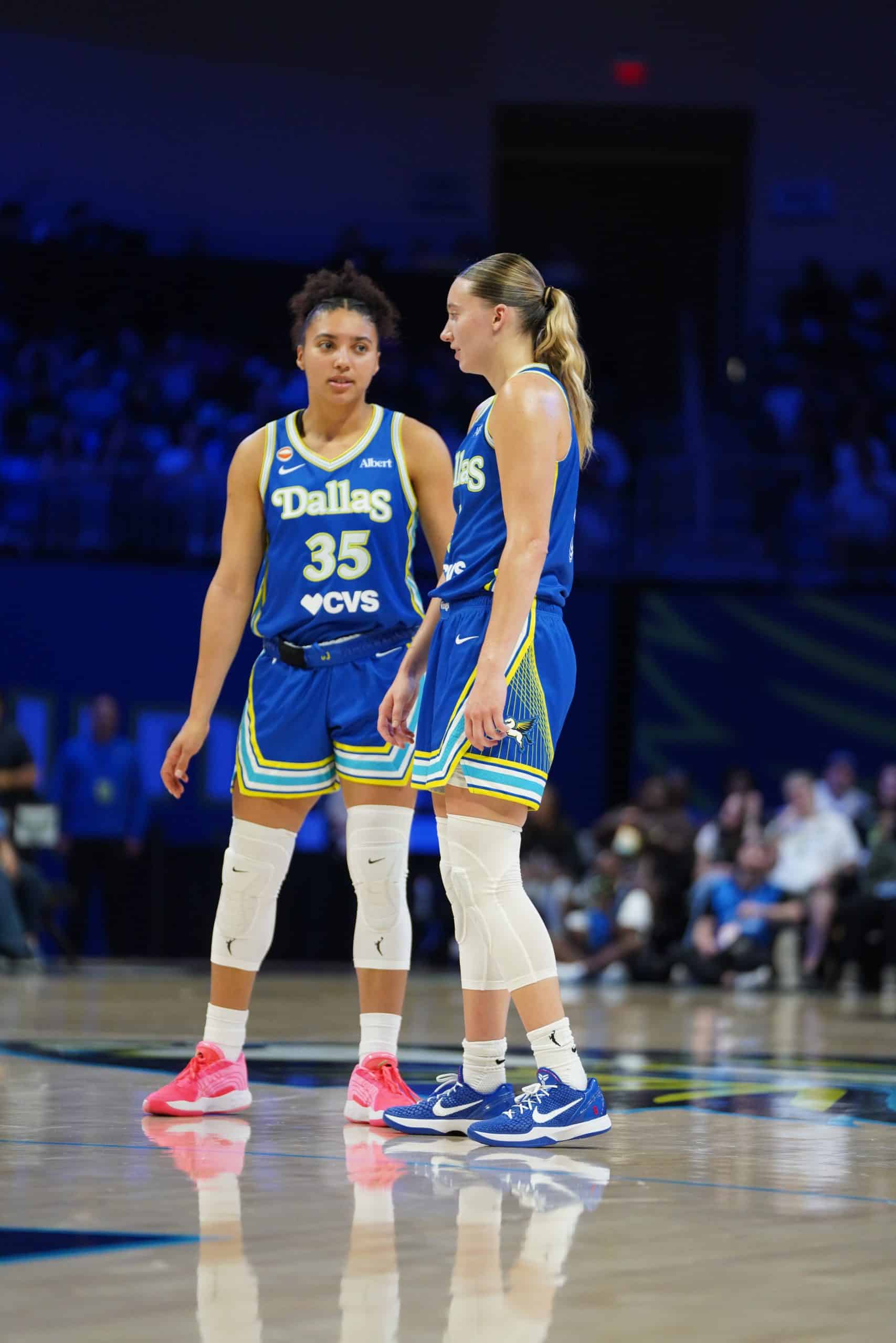 Azzi Fudd and Paige Bueckers Two basketball players discussing strategy