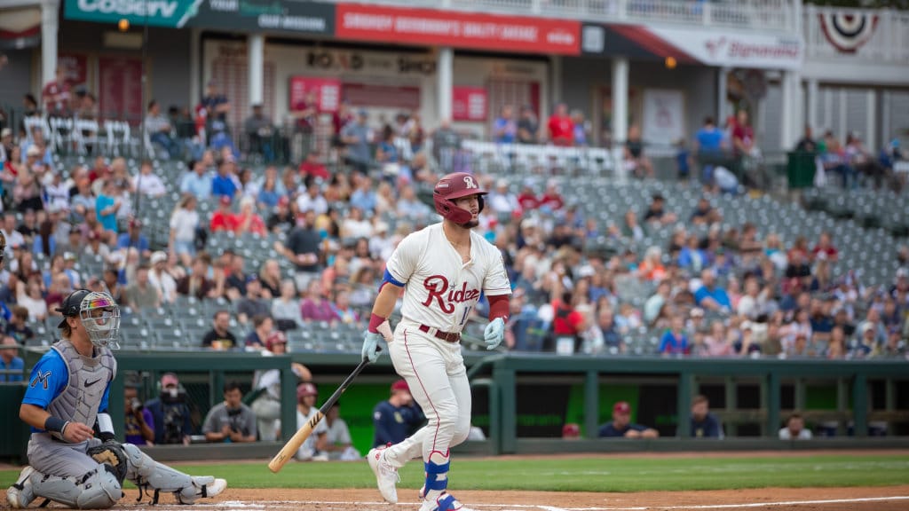 MiLB Baseball player at bat, crowd watching