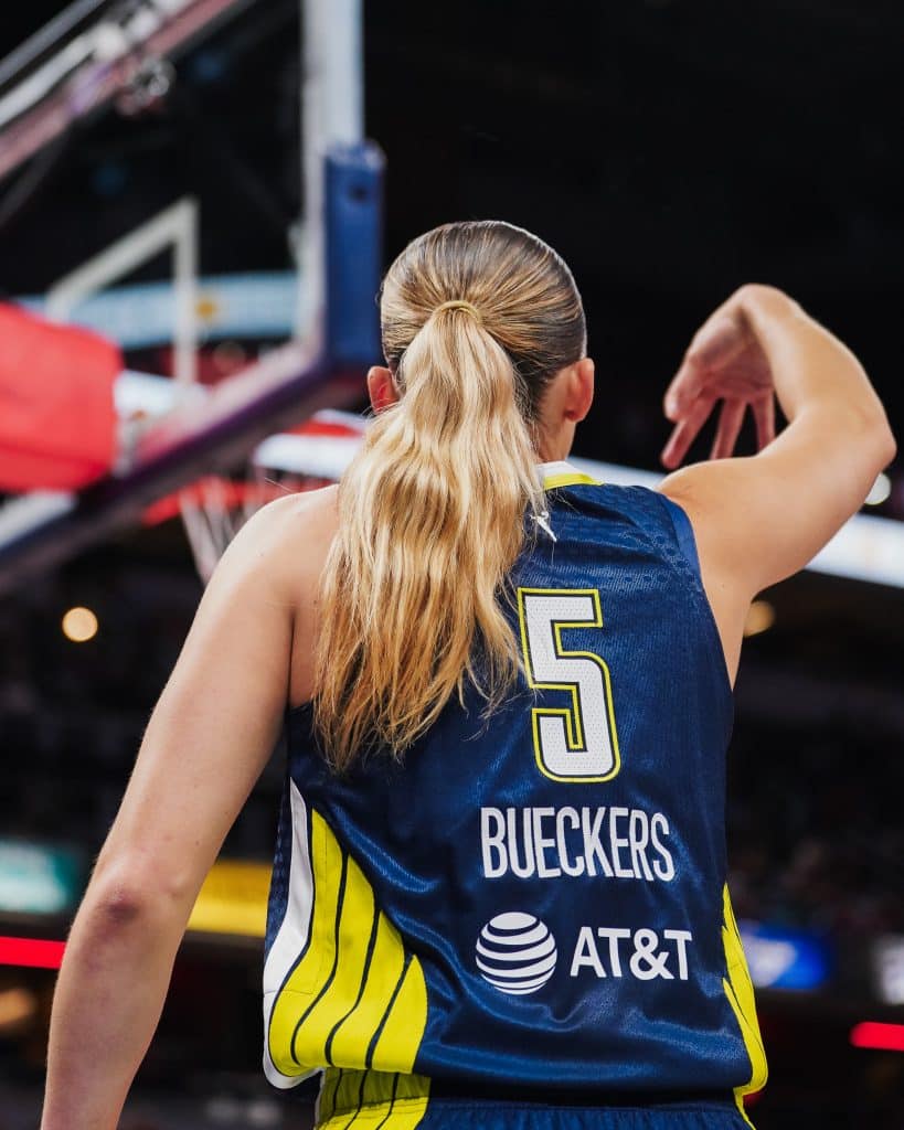 Paige WNBA Basketball player in action, jersey visible.